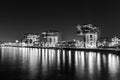 Crane houses at night in black and white