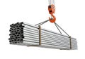 Crane lifting bundle of metal steel bars for construction Royalty Free Stock Photo