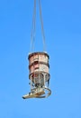 Crane lifting cement mixing container Royalty Free Stock Photo