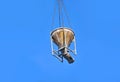Crane lifting cement mixing container Royalty Free Stock Photo