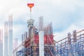 Crane lifting concrete mixer container and worker in construction building site workplace. on sky background with copy space add Royalty Free Stock Photo