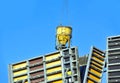 Crane lifting cone tank over formwork Royalty Free Stock Photo