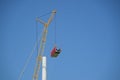 Crane lifting the nacelle to install it onto the tower of a wind turbine on a construction site, electricity, renewable energy and Royalty Free Stock Photo