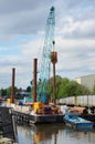 a crane in action on the river during maintenence or construction