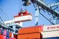 Crane lifts shipping container