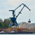 Crane loading industrial cargo ship Royalty Free Stock Photo