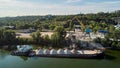 Crane is loading sand and gravel onto barge ship for river transport. Aerial drone Royalty Free Stock Photo