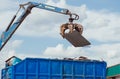 Crane-loading scrap grabber old metal at industrial metal recycling plant Royalty Free Stock Photo