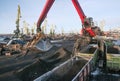 Crane manipulator unloads coal at the seaport.