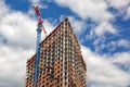 Crane near a skyscraper under construction Royalty Free Stock Photo