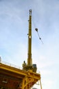 Crane operation transfer cargo on the platform and moving cargo from supply boat, heavy lift in oil and gas construction platform Royalty Free Stock Photo