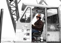 A Crane Operator Devotes Attention to a Lift Royalty Free Stock Photo