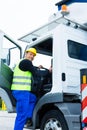 Crane operator driving with truck of construction site Royalty Free Stock Photo