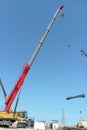 crane operator lifting iron at a construction project site