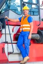 Crane operator standing on company yard Royalty Free Stock Photo