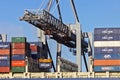 Crane operator unloading a container from a cargo ship Royalty Free Stock Photo