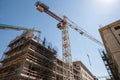 Crane over construction site with scaffolding Royalty Free Stock Photo