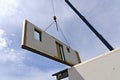 Crane with part of a prefabricated house