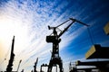 Crane port shadows on a background of blue sky Royalty Free Stock Photo