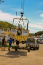 Crane lifts a boat. Royalty Free Stock Photo