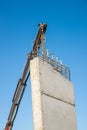 Crane removing concrete encasement