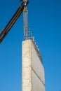 Crane removing concrete encasement Royalty Free Stock Photo