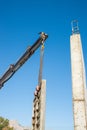 Crane removing concrete encasement