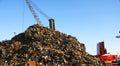 Crane with scrap heap in the port of Barcelona Royalty Free Stock Photo