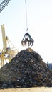 Crane with scrap heap in the port of Barcelona Royalty Free Stock Photo