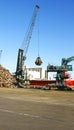 Crane with scrap heap in the port of Barcelona Royalty Free Stock Photo