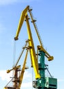 Crane at the scrapyard in the seaport Royalty Free Stock Photo