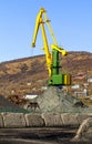 Crane at the scrapyard in the seaport Royalty Free Stock Photo