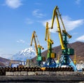 Crane at the scrapyard in the seaport Royalty Free Stock Photo