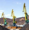 Crane at the scrapyard in the seaport Royalty Free Stock Photo