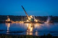 Crane on the ship produces sand on the river Royalty Free Stock Photo