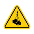Crane sign. Crane warning sign with suspended load. Yellow triangle sign with a crate attached to a hook inside. Caution crane,
