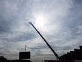 Crane, Silhouette of crane at a construction site on a background of the sky Royalty Free Stock Photo