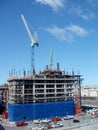 Crane on top Construction site of condo tower high up in San Francisco