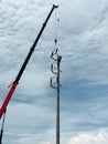 The crane truck is lifting of 115kV Disconnecting switch to the installation point Royalty Free Stock Photo