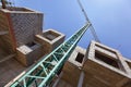 Crane and unfinished apartments - construction site Royalty Free Stock Photo