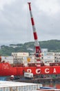 Crane unloaded container cargo ship Sevmorput FSUE Atomflot - Russian nuclear-powered icebreaker lighter aboard ship