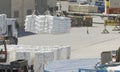 Crane Unloading Sacks At Busy Commercial Dock