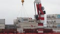 Crane unloads Russian container ship Sevmorput - nuclear-powered icebreaker lighter aboard ship carrier