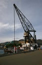 Preservation of historic crane vessel of Hikitia refurbished and moored at waterfront freight pier in Wellington, New Zealand