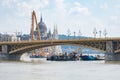 Crane and work boats operating at the site of an accident where two boats collided under the Margaret Bridge