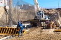 Crane and worker working on a construction site