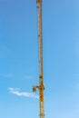 Crane and workers at construction site against blue sky Royalty Free Stock Photo