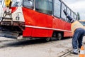 Crane and workers are lining up a derailed tram. Royalty Free Stock Photo