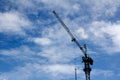 Crane working in blue sky Royalty Free Stock Photo