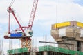 Crane working building in city on sky. Royalty Free Stock Photo